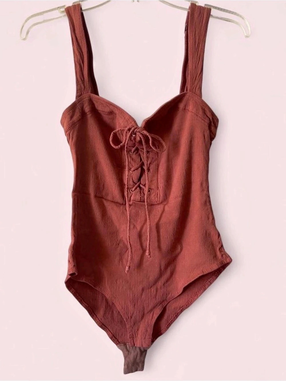 Free People bodysuit with lace up detail